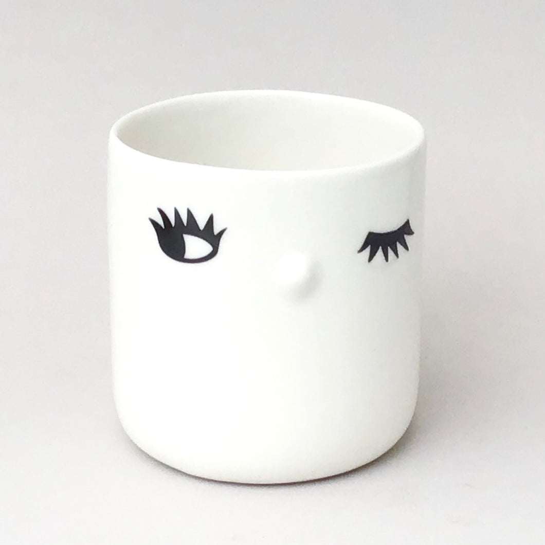 Nosy mug, one open eye